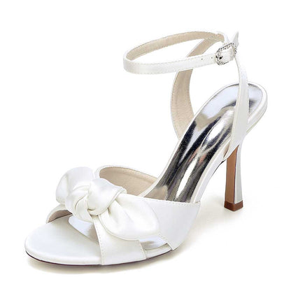 Elegant women's bridal silk satin heels with a bow and ankle strap for special occasions