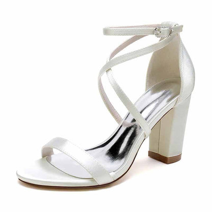 White women's chunky heel ankle strap sandals with crisscross design and a stylish block heel
