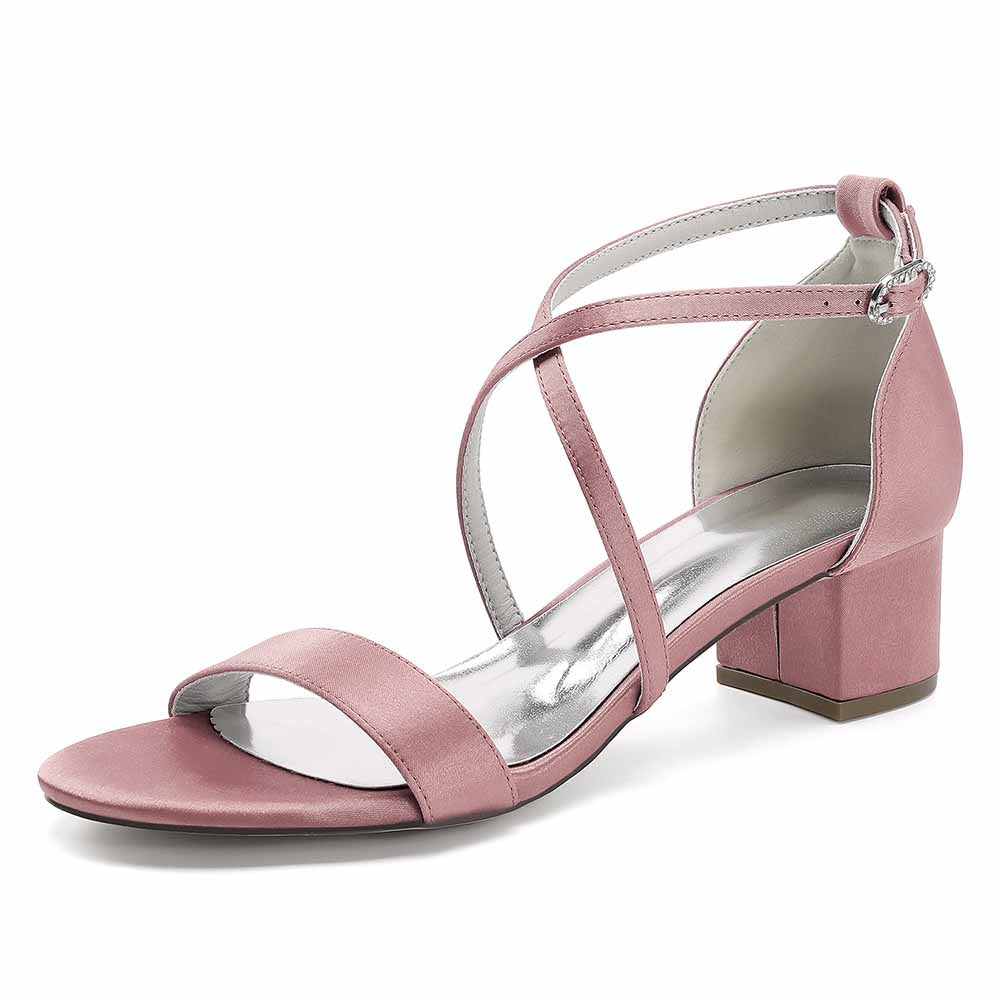 Pink women's chunky heel bridesmaid sandals with cross straps and a comfortable block heel