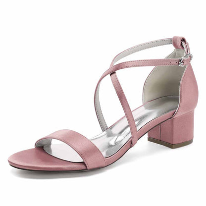 Pink women's chunky heel bridesmaid sandals with cross straps and a comfortable block heel