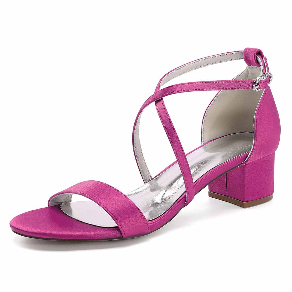 Fashionable women's chunky heel bridesmaid sandals in bright pink with crisscross straps