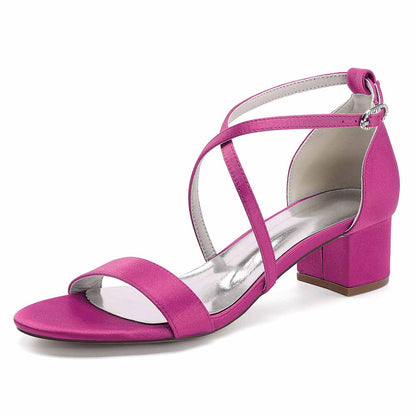 Fashionable women's chunky heel bridesmaid sandals in bright pink with crisscross straps