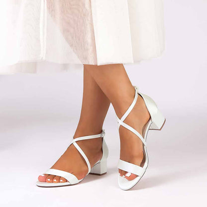 Women's chunky heel bridesmaid sandals in white with crisscross straps and a comfortable design