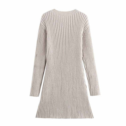 Women's cozy knit mini dress in light beige with a ribbed texture and long sleeves
