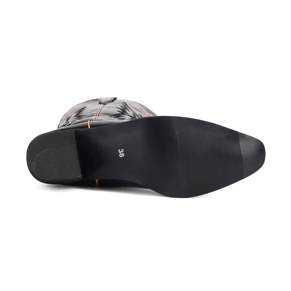 Sole of women's embroidered cowboy boots featuring stylish design and durable traction