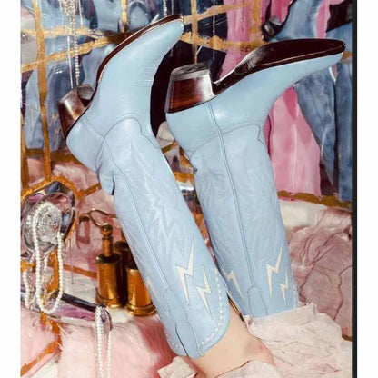Stylish women's embroidered cowboy boots in light blue with intricate designs and high heels