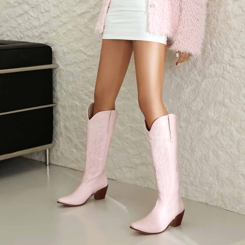 Stylish women's embroidered cowboy boots in pink with intricate patterns for a trendy look