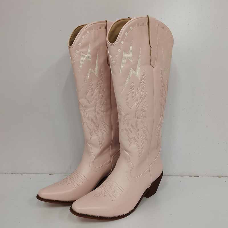 Stylish women's embroidered cowboy boots in pink with intricate stitching and classic design