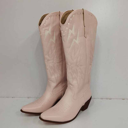 Stylish women's embroidered cowboy boots in pink with intricate stitching and classic design