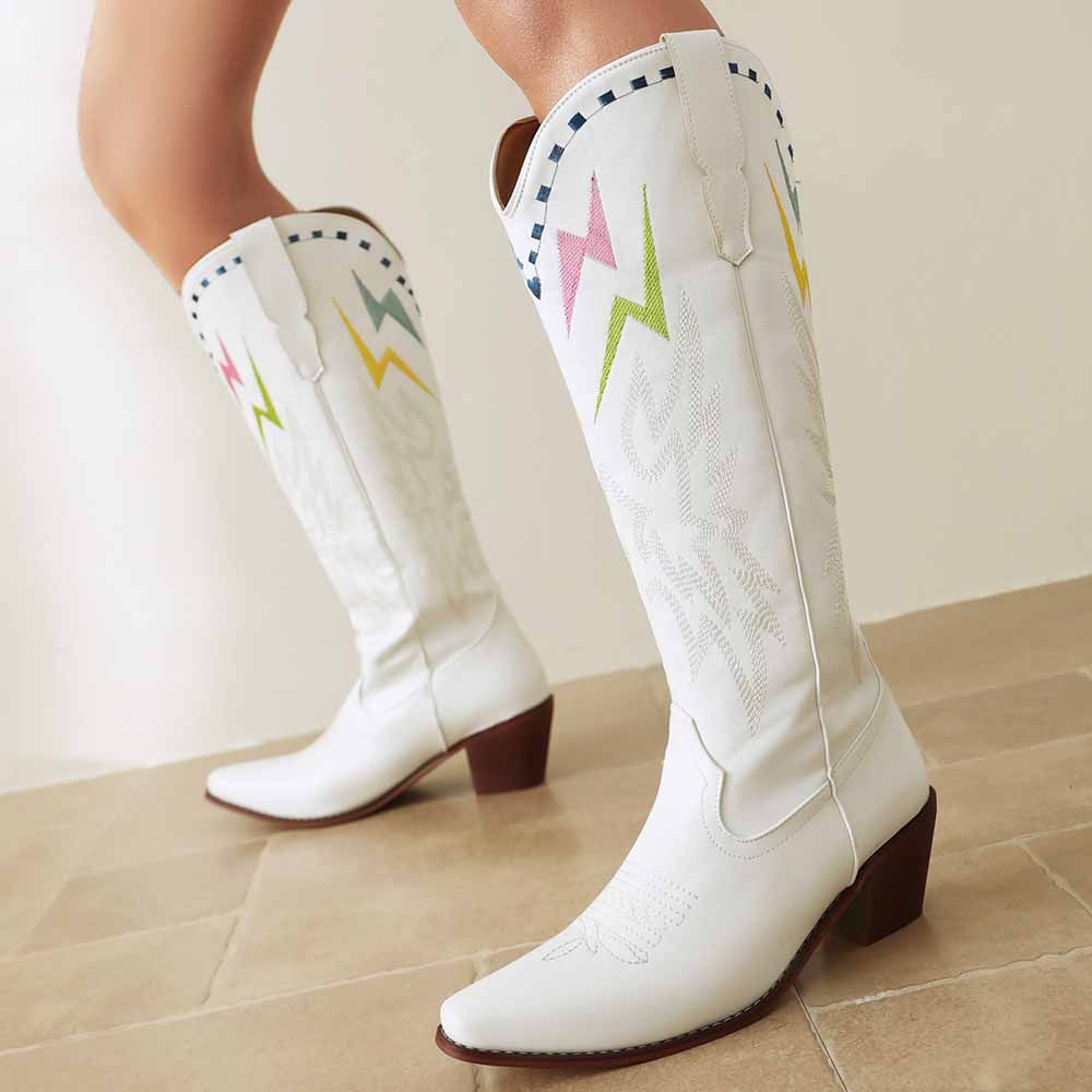 Stylish women's embroidered cowboy boots in white with colorful designs and a pointed toe