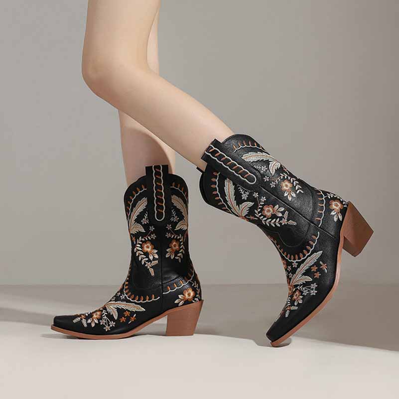 Women's embroidered cowgirl boots featuring intricate floral designs and a stylish heel