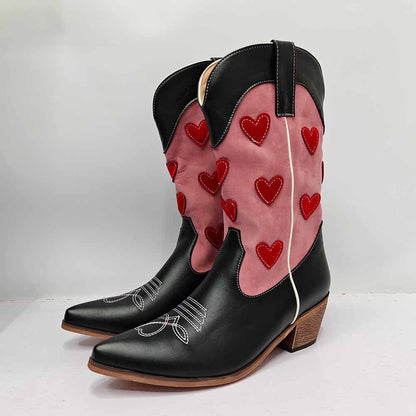 Stylish women's embroidered cowgirl boots featuring red heart designs and a pointed toe