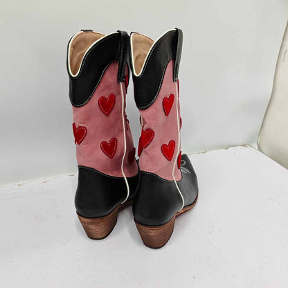 Back view of women's embroidered cowgirl boots featuring red heart designs and a stylish black and pink color scheme