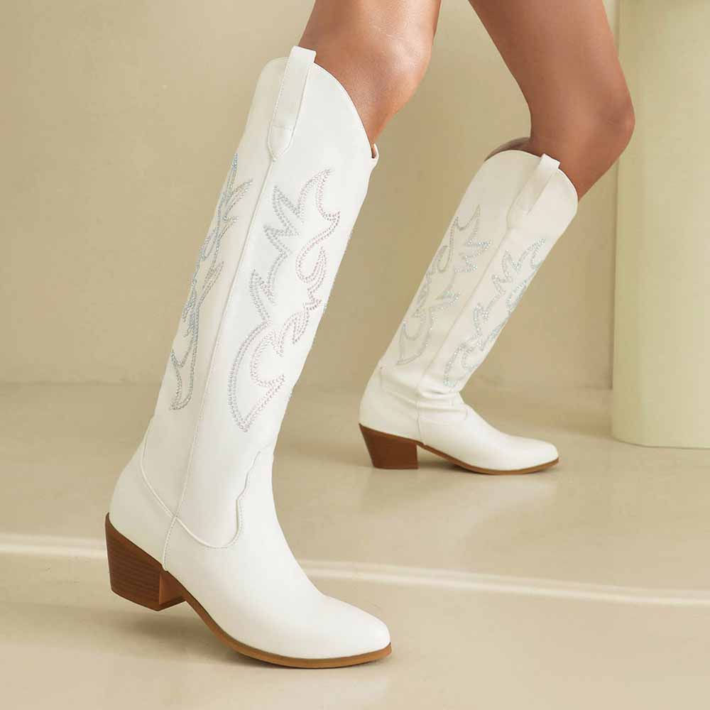 Stylish women's embroidered cowgirl boots in white with elegant stitching and a sleek design