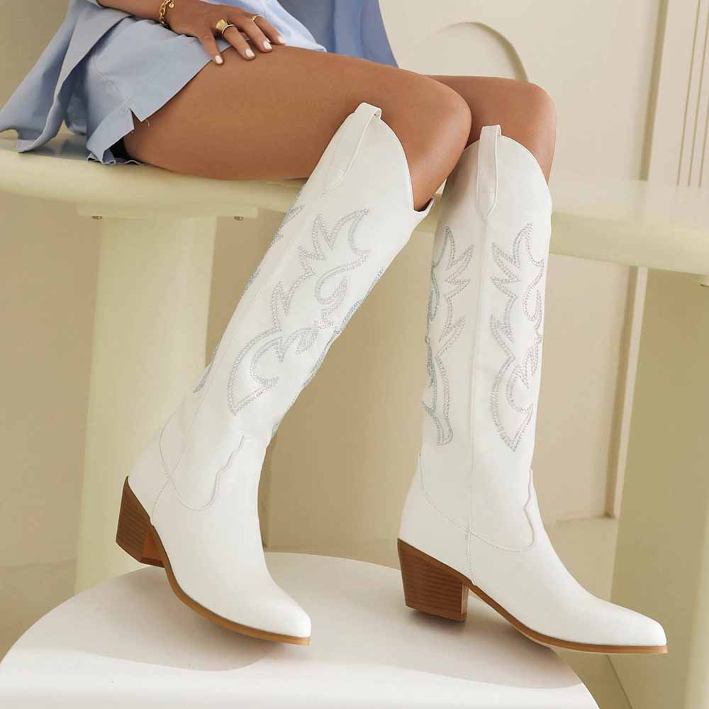Stylish women's embroidered cowgirl boots in white with detailed stitching and a pointed toe design