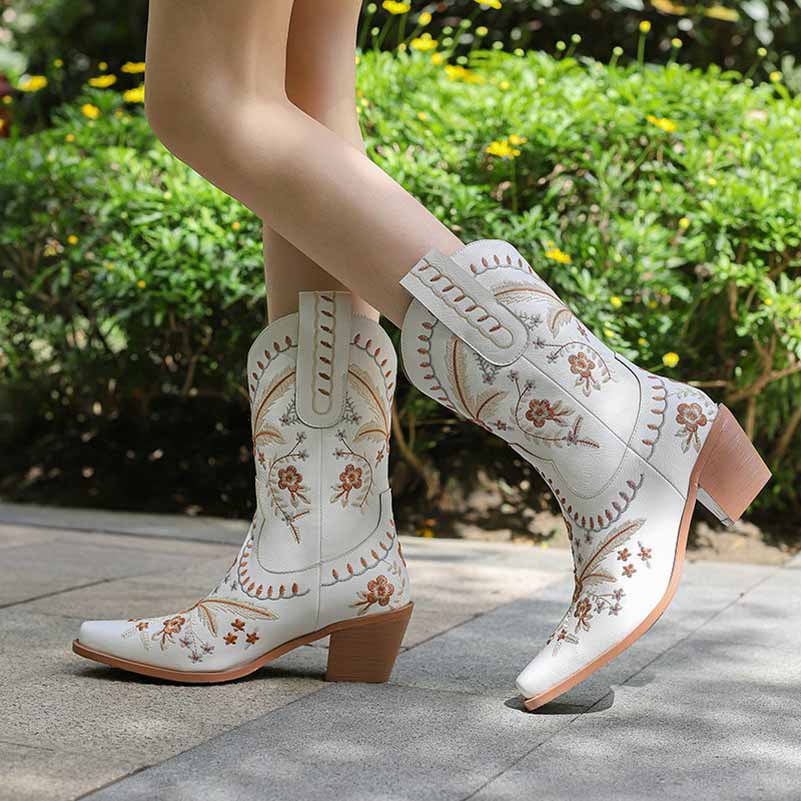 Stylish women's embroidered cowgirl boots in white with floral designs, perfect for casual wear