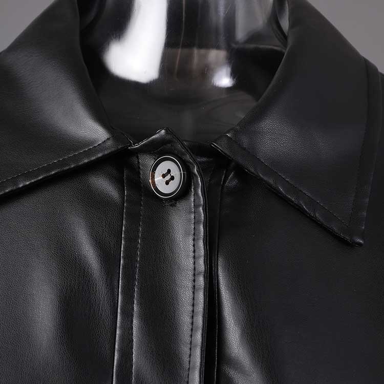 Close-up of women's faux leather biker jacket featuring a sleek design and button detail
