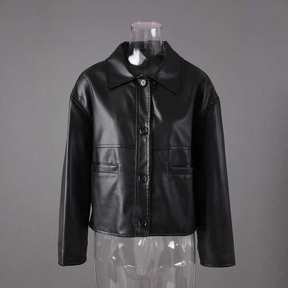 Women's faux leather biker jacket in black with a classic button-up design and sleek style