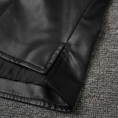 Close-up of the hem detailing on a women's faux leather biker jacket for stylish layering