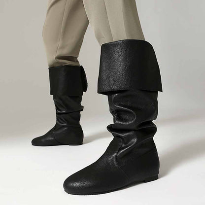 Women's faux leather flat boots with stylish slouch design, perfect for casual wear