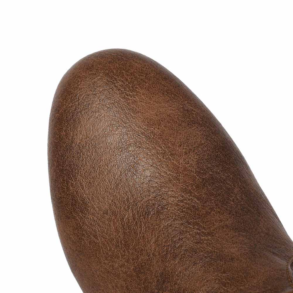 Close-up of women's faux leather flat boots in brown showcasing the textured design and sleek silhouette