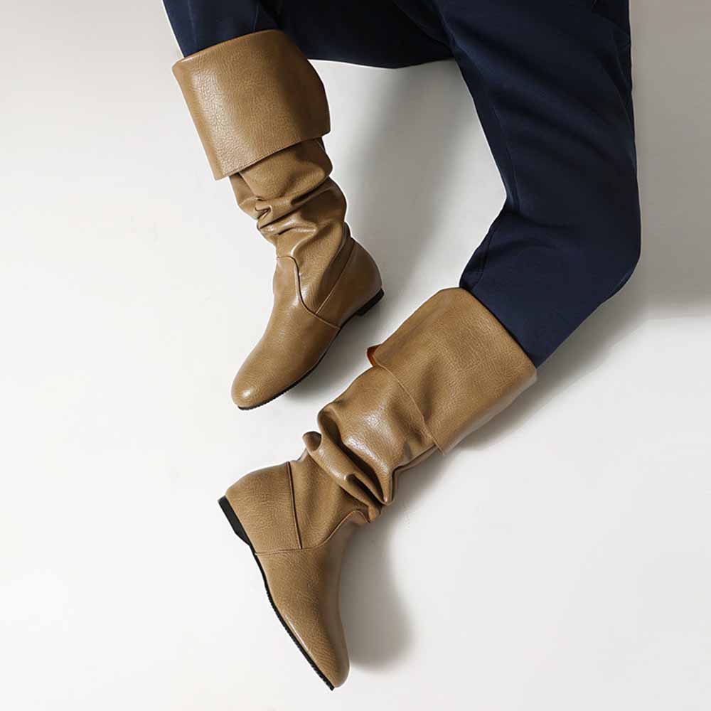 Stylish women's faux leather flat boots in tan color, featuring a slouchy design for a chic look