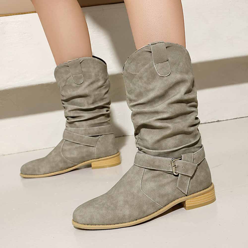 Stylish women's flat suede ankle boots in beige with adjustable straps and a comfortable fit