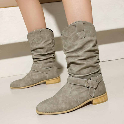 Stylish women's flat suede ankle boots in beige with adjustable straps and a comfortable fit