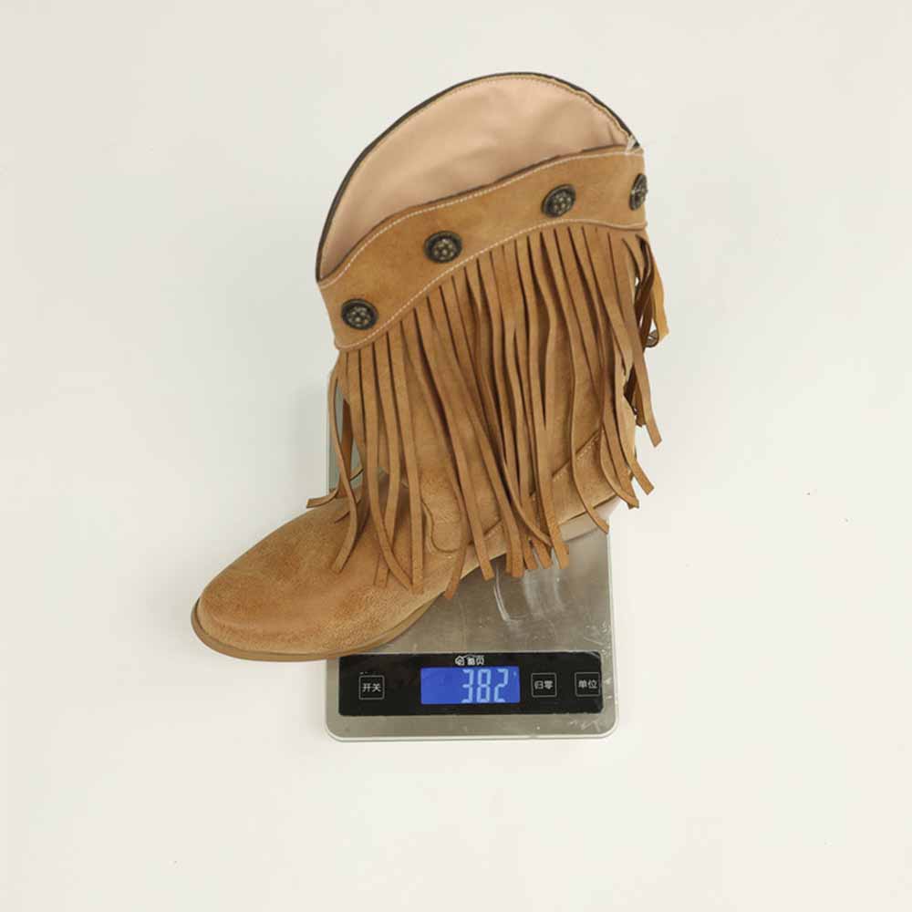 Women's fringe cowgirl boots in tan color displayed on a scale, showcasing stylish design and details