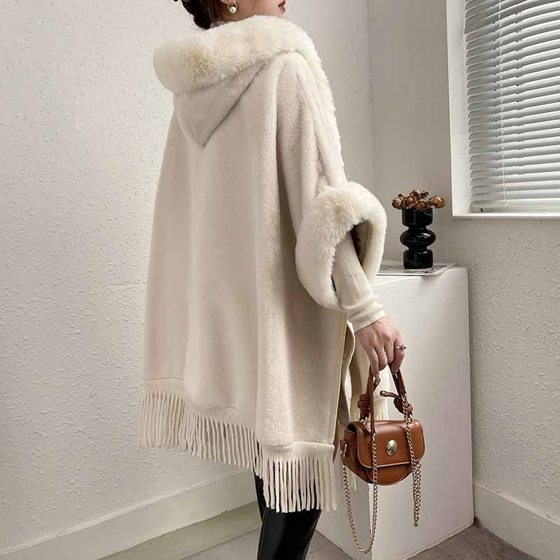 S&DCo. women's fur collar poncho in cream with fringe detail and hood, perfect for stylish layering