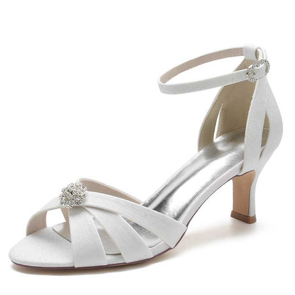 Elegant women's glitter ankle strap sandals in white with a jeweled embellishment and stylish design