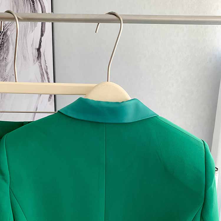 Back view of a stylish women's green pantsuit formal by SD Dresscode & Fashiontrends, ideal for elegant occasions