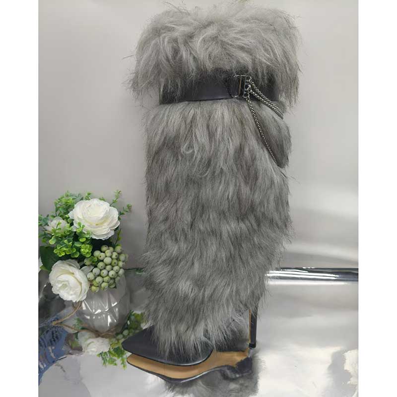 Stylish women's grey faux fur boots with high heels and decorative belt for a trendy look.
