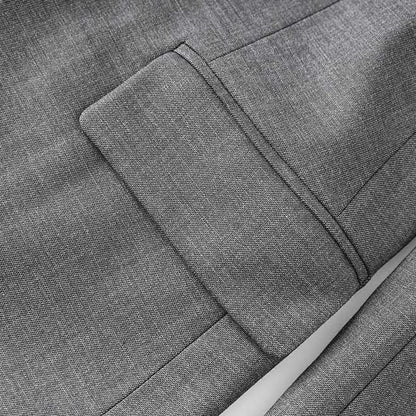 Close-up of women's grey tailored pantsuit showcasing premium fabric and detailed stitching