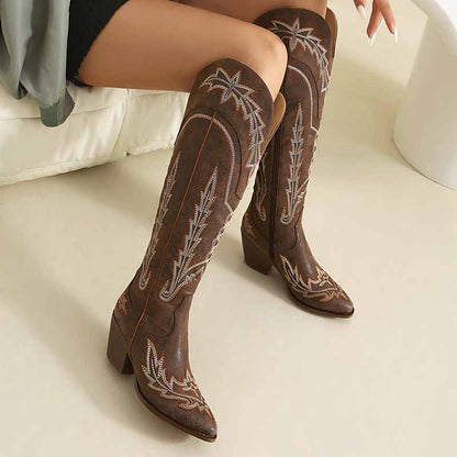 Stylish women's knee high cowboy boots with intricate stitching and a stacked heel