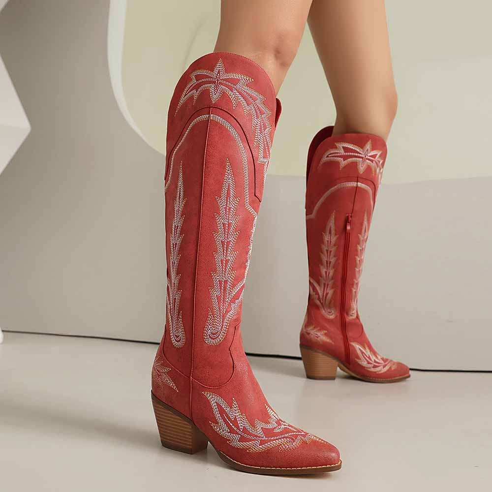 Stylish women's knee high cowboy boots in red with intricate embroidery, perfect for fashionable outfits