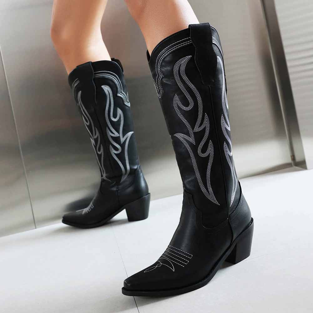 Stylish women's knee high western boots in black with intricate silver embroidery and a pointed toe