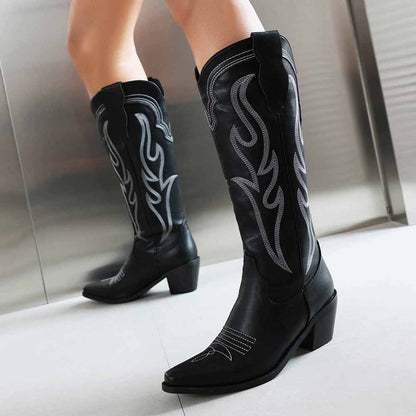 Stylish women's knee high western boots in black with intricate silver embroidery and a pointed toe