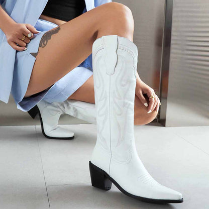 Stylish women's knee high western boots in white with a block heel and intricate detailing