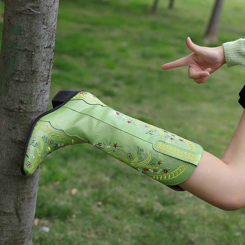 Stylish women's knee length cowgirl boots in green with decorative embroidery, perfect for casual outings