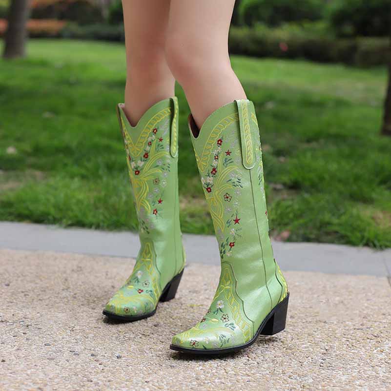 Stylish women's knee length cowgirl boots in green with floral embroidery and a sturdy heel