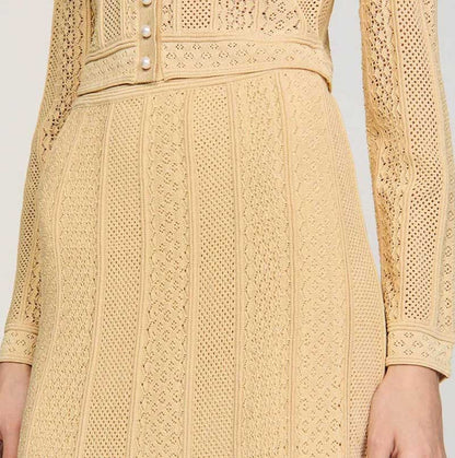 Stylish women's knit long skirt suit in beige featuring intricate knit patterns and elegant button details