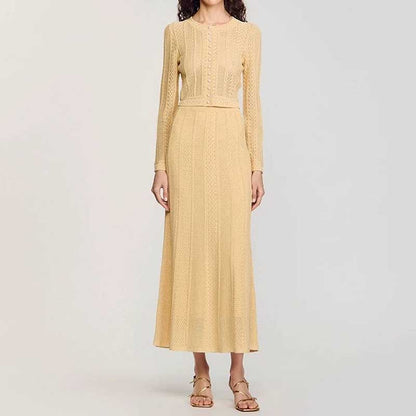 Elegant women's knit long skirt suit in soft yellow with long sleeves and a fitted waist design