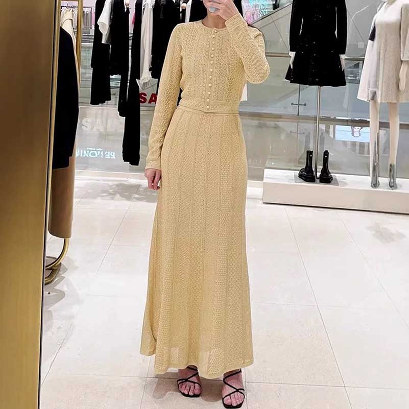 Women's knit long skirt suit in light beige with button detailing and long sleeves for stylish occasions