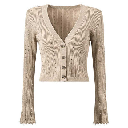 Beige women's knitted crop top and midi dress set featuring a ribbed texture and decorative buttons