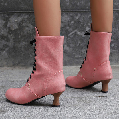 Stylish women's lace-up ankle boots in pink with elegant heel for trendy outfits