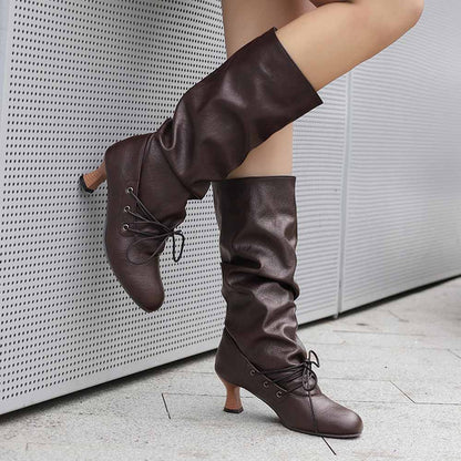 Stylish women's lace-up high shaft boots in brown with a chic design and comfortable heel
