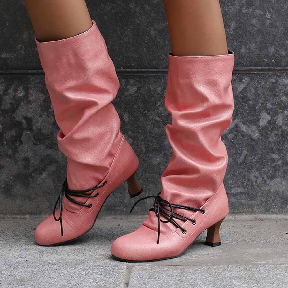 Stylish women's lace-up high shaft boots in pink, featuring a slouchy design and comfortable heels