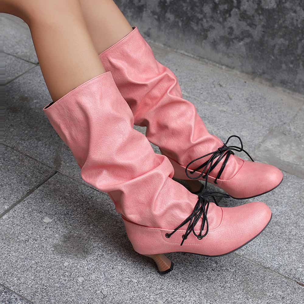 Stylish women's lace-up high shaft boots in pink with a slouchy design and elegant heels