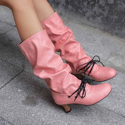 Stylish women's lace-up high shaft boots in pink with a slouchy design and elegant heels